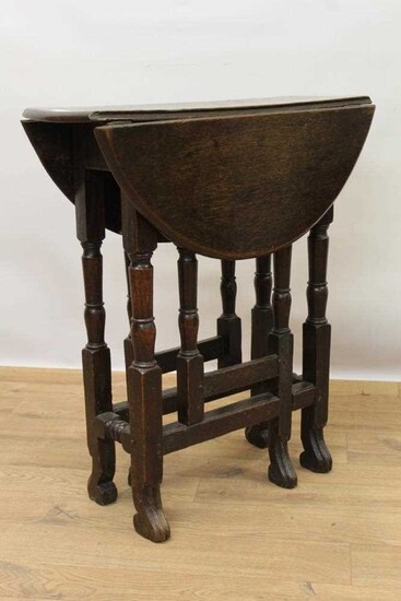 Small late 17th / early 18th century oak gateleg table on turned supports joined by stretchers on scroll feet