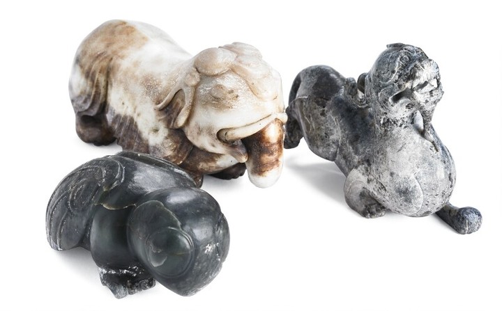 Three Chinese figurines of white and green jade in the shape of an elephant, chilong dragon and leafhopper. Weight 5817 g. L. 15–23 cm. (3)