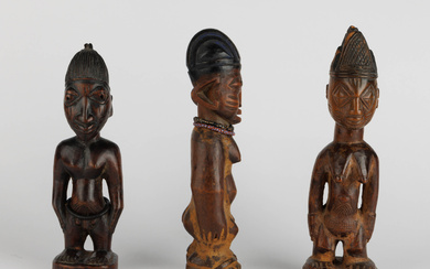 Three Yoruba ibeji figures, two male and one female. Nigeria. Early 20th century.
