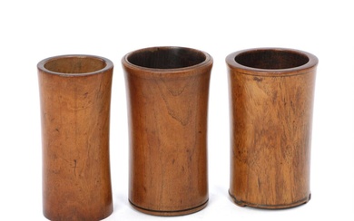 Three small huanghuali and hardwood brushpot, bitong, of slight tapering form, one...
