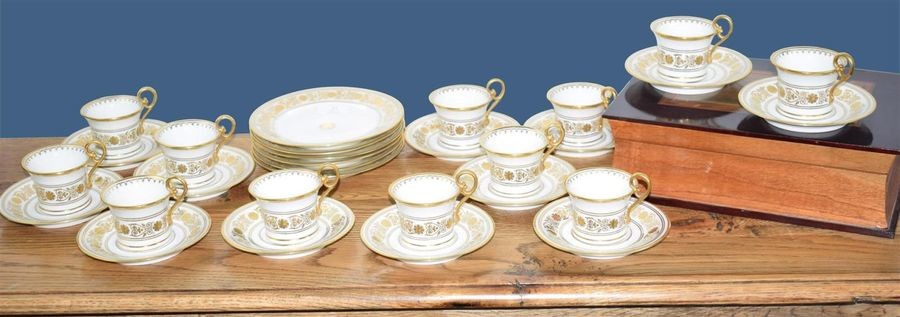 Twelve cups and saucers and six dessert plates...