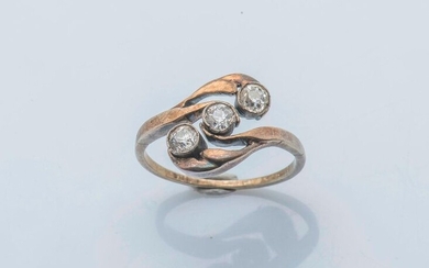 Vermilion ring (800 thousandths) set with three antique cut diamonds in a foliage arranged in you and me.
