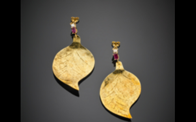 Yellow gold pendant leaf earrings accented with diamonds and...