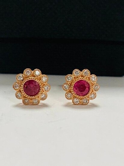 14ct Rose Gold Ruby and Diamond flower design stud earrings featuring centre, 2 round cut, pinkish red Rubies (0.60ct TSW), bezel set, with 20 round brilliant cut Diamonds (0.25ct TDW), mill-grain bezel set.