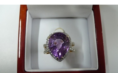 18ct Gold dress ring set with large pear shaped amethyst wit...