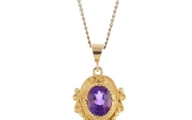 A 9ct gold amethyst pendant. The oval-shape amethyst