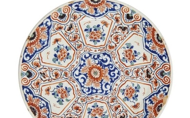 28-Delft: a polychrome earthenware plate with a radiant "Cashmire" decoration....