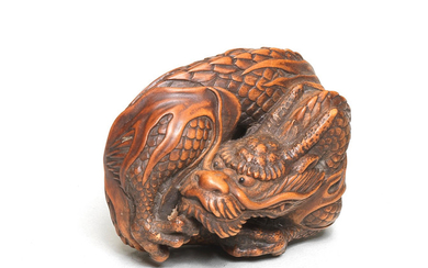 A boxwood netsuke of a dragon