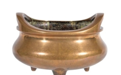 A Chinese bronze twin-handled tripod censer
