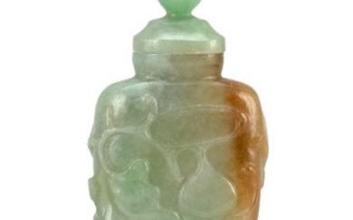CHINESE GREEN AND RUSSET JADEITE SNUFF BOTTLE In temple jar form, with relief-carved gourd and vine design. Height 3.3". Conforming...