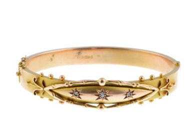 An early 20th century 9ct gold diamond hinged bangle. View more details