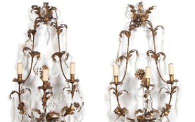 A Pair of Louis XV Style Gilt Metal and Crystal Three-Light Wall Sconces