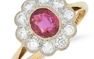 RUBY AND DIAMOND CLUSTER RING set with an oval cut ruby