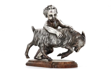 A Victorian silver model of a cherub with a billy goat