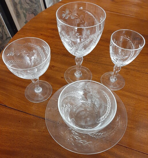 32-PIECE PARTIAL SERVICE CUT COLORLESS CRYSTAL STEMWARE. Including eight water...