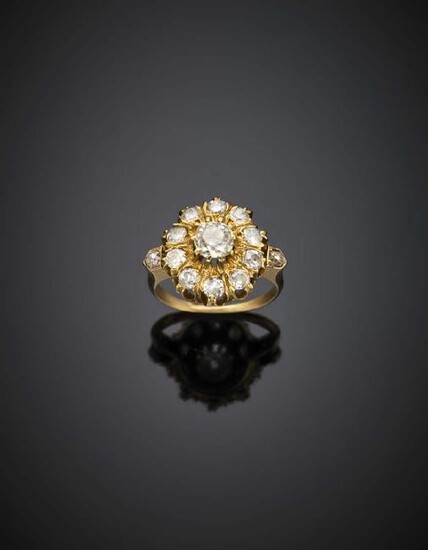 Yellow gold diamond cluster ring with a shaped stem, in