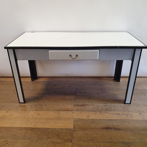 A 1920s white and black enamel table, with a single drawer, ...