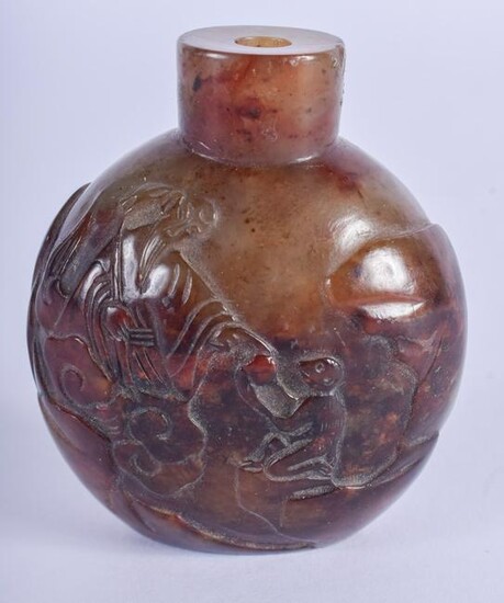 A 19TH CENTURY CHINESE CARVED RUSSET JADE SNUFF BOTTLE