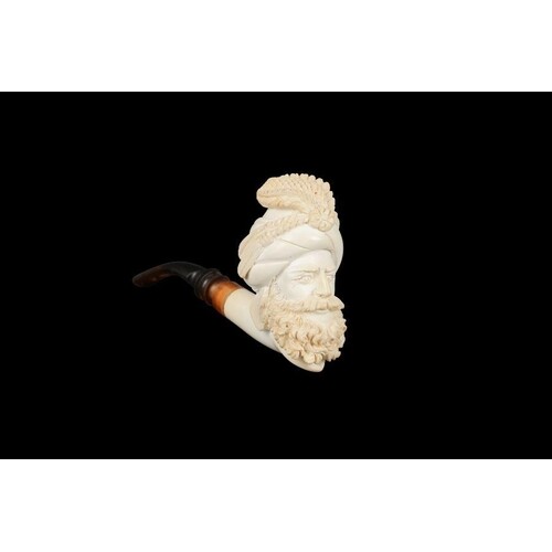 A 19TH CENTURY MEERSCHAUM PIPE CARVED IN THE ORIENTALIST STY...