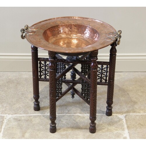 A 19th century copper brazier bowl, applied with brass side ...