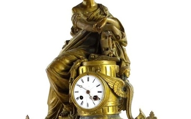 A 19thC French gilt metal figural mantel clock, modelled...
