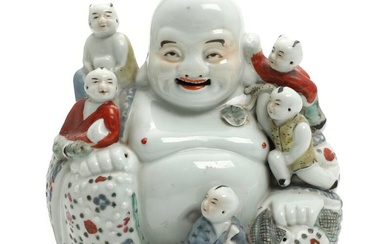 A 20th century Chinese porcelain figure of Budai surrounded by children, decorated...