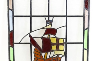 A 20thC stained glass panel depicting a sailing ship with flag. Approx. 33" x 22" Please Note - we