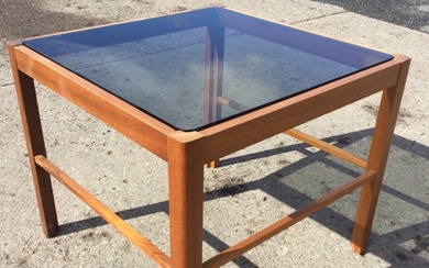 A 70s square mahogany coffee table with smoked glass top...