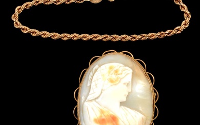 A 9 carat yellow gold bracelet and a shell cameo brooch.