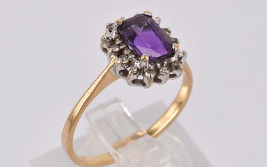 A 9CT GOLD DIAMOND AND AMETHYST RING
