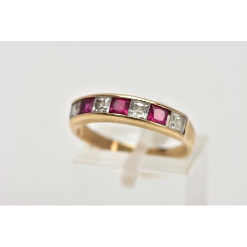 A 9CT GOLD HALF ETERNITY RING, designed with a row of channe...