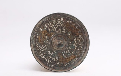 A CHINESE SILVER AND GOLD INLAID BRONZE MIRROR