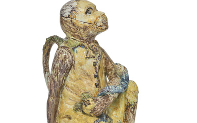 A CONTINENTAL FAYENCE JUG AND COVER MODELLED AS A MONKEY CIRCA 1770, PROBABLY PROSKAU