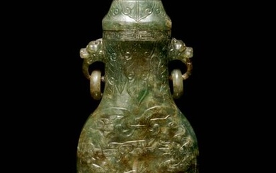 A Carved Spinach Green Jade Ring-Handled Vase and Cover