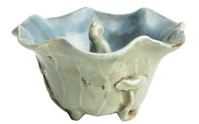 A Chinese Porcelain Celadon Trick Cup with the Figure