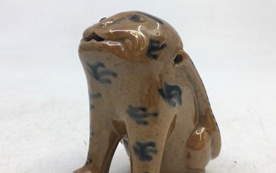 A Chinese Qing dynasty pottery figure of a dog