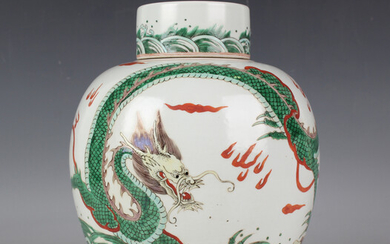 A Chinese famille verte porcelain ginger jar and cover, the ovoid body painted with a dragon and lea