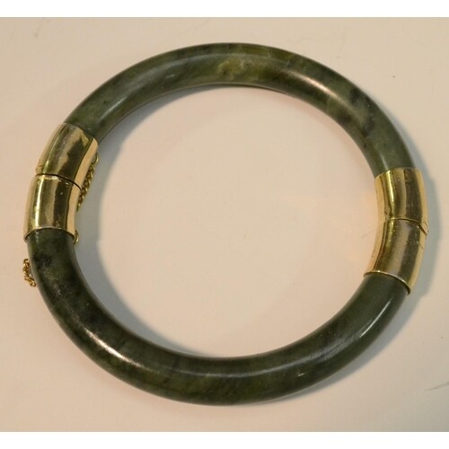 A Chinese gilt metal mounted green hardstone hinged bangle, ...