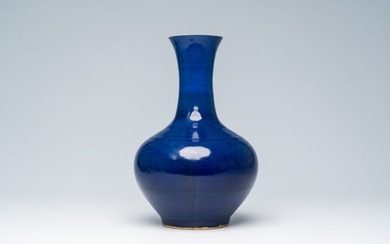 A Chinese monochrome blue glazed bottle vase, 19th C.