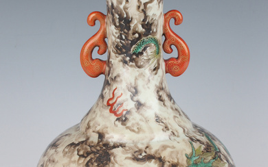 A Chinese porcelain bottle vase, the globular body and flared narrow neck painted with blue and gree