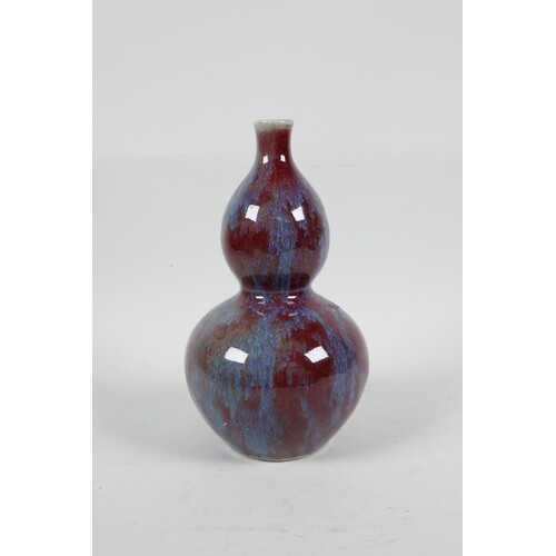 A Chinese red and blue flambe glazed porcelain double gourd ...