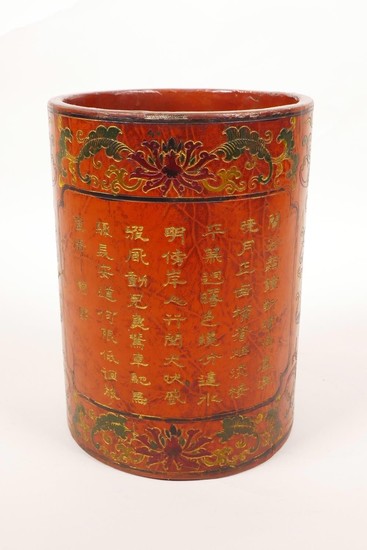 A Chinese red lacquer brush pot decorated with bats, lotus f...
