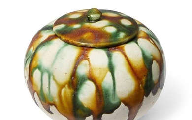 A Chinese sancai-glazed ovoid jarlet and cover, Tang dynasty, splashed...