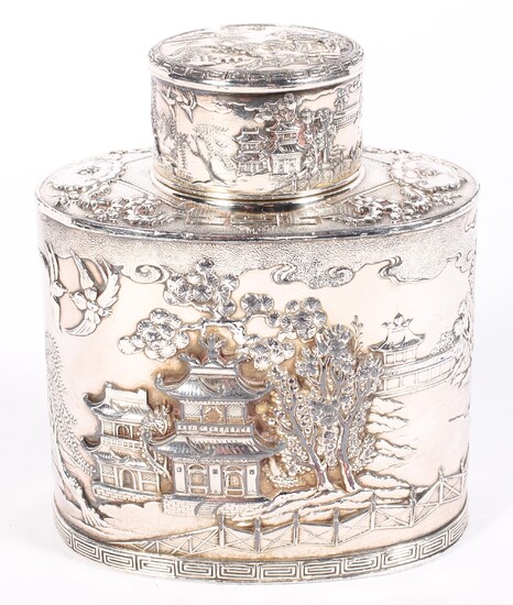 A Chinoiserie white metal oval tea caddy, 20th century