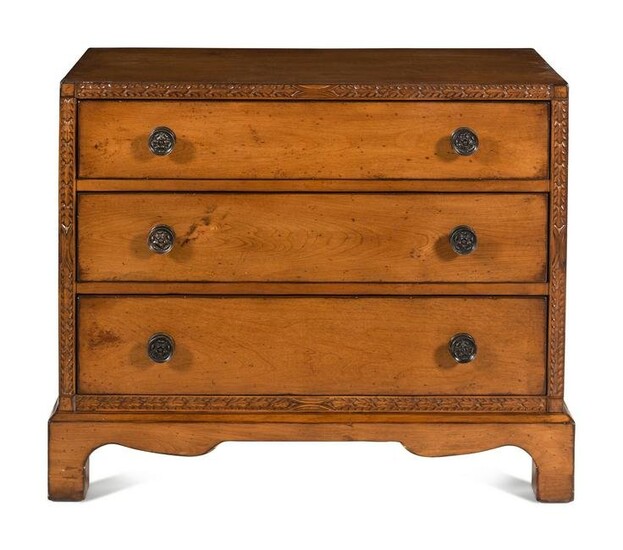 A Contemporary Carved Walnut Chest of Drawers