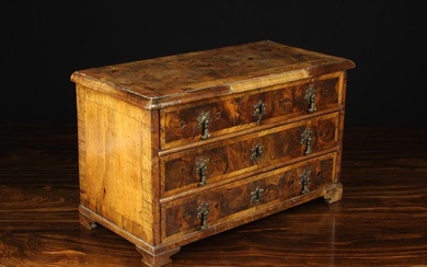 A Delightful Early 18th Century miniature walnut & yew veneered Chest of Drawers. The oyster veneere