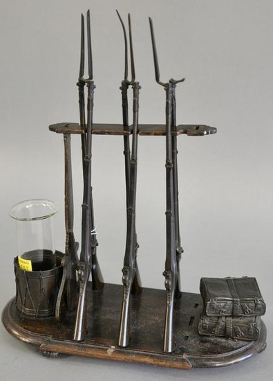 A French bronze desk ornament modeled as a gun rack