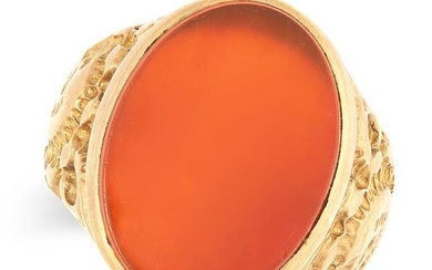 A GENTLEMAN'S CARNELIAN SIGNET RING set with a polished