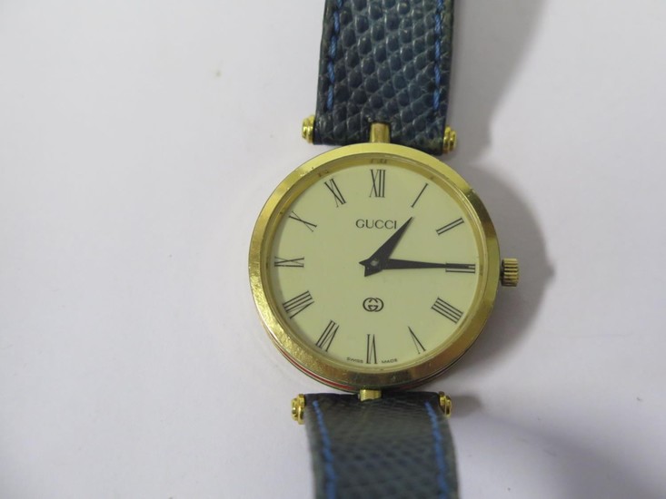 A GUCCI Gold Plated Wristwatch with red and green enamel ban...
