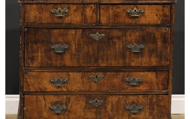 A George I walnut chest, moulded crossbanded top above two s...